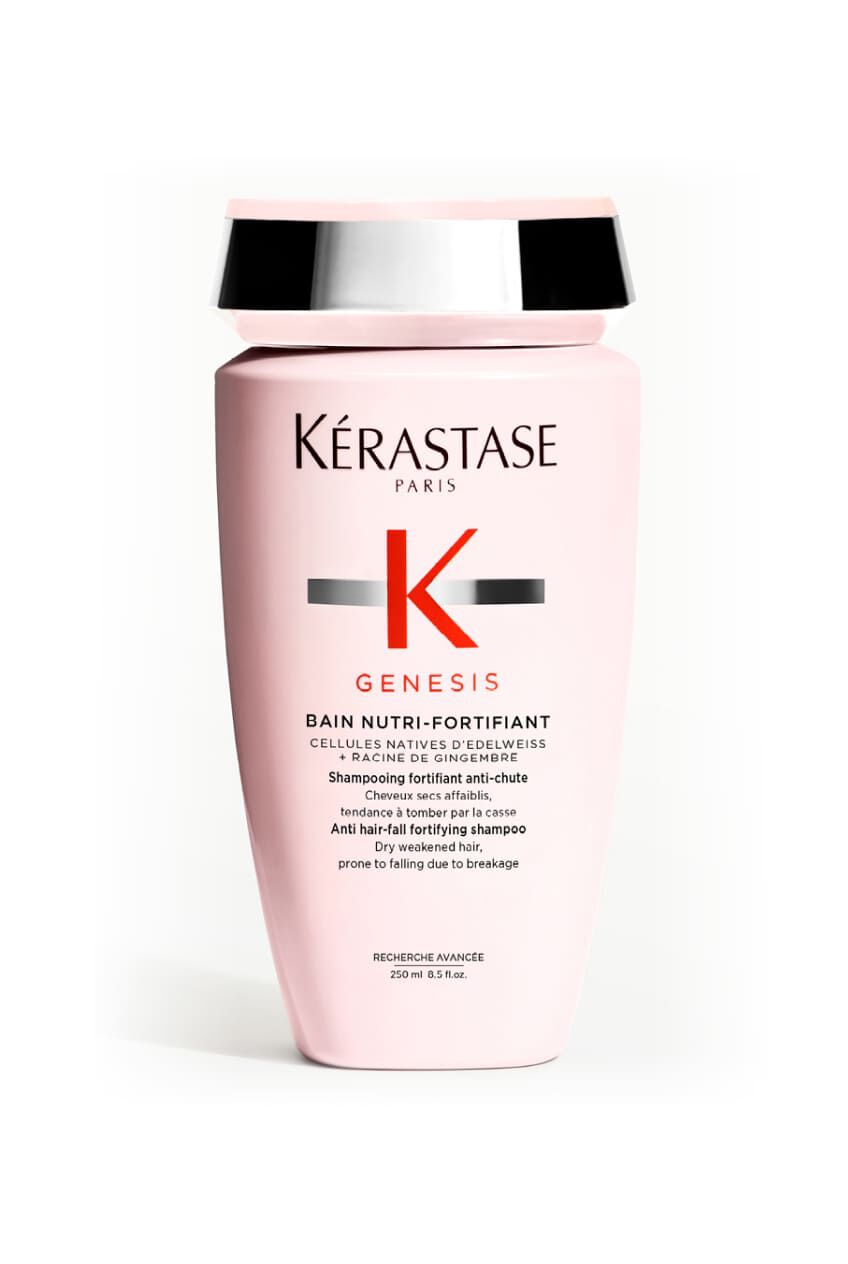 Botella rosa opaca del champu Kerastase Genesis Bain Nutri-Fortifiant para cabello seco y debilitado.
