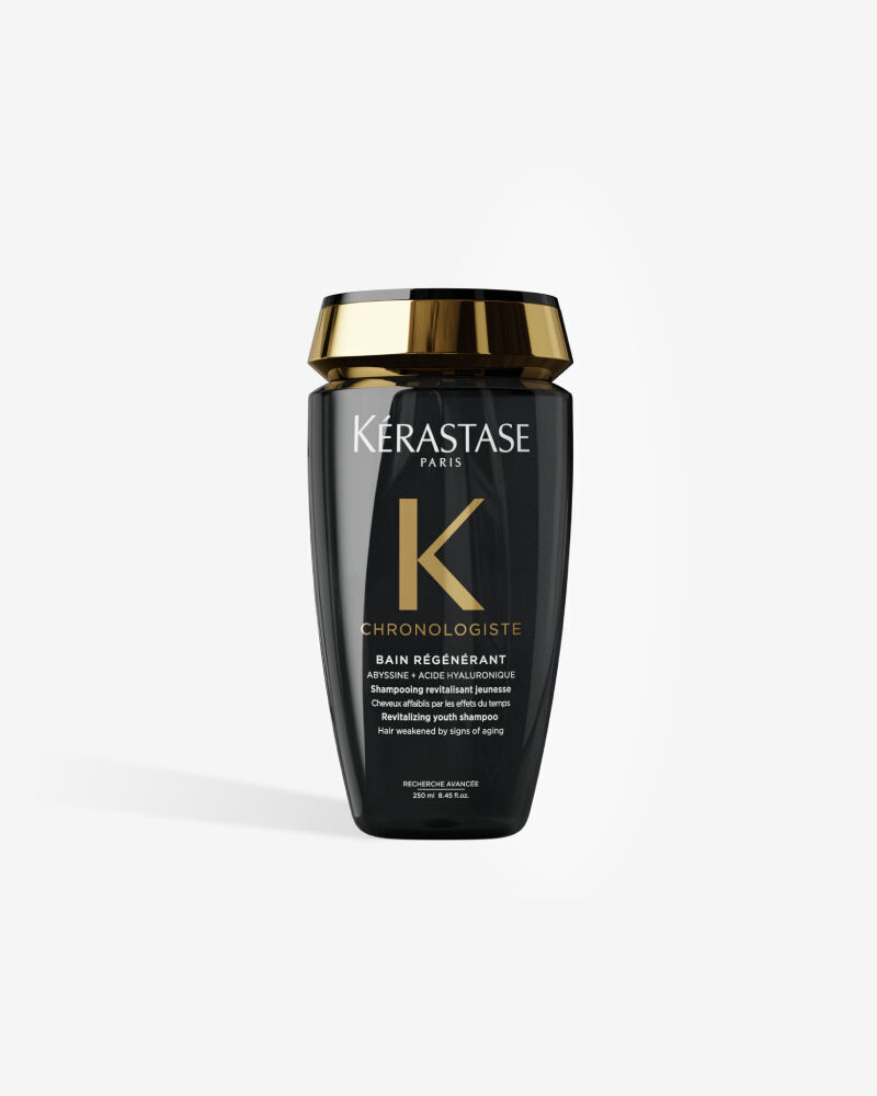Champu revitalizante Kerastase Chronologiste Bain Regenerant en una elegante botella negra con tapon dorado.