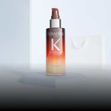 Frasco naranja del Serum Noche 8H Nutritive de Kerastase.