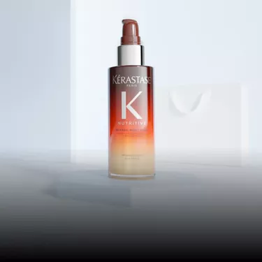 Frasco naranja del Serum Noche 8H Nutritive de Kerastase.