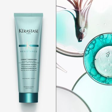 El ciment thermique Resistance Kerastase e appoggiato su un supporto bianco.