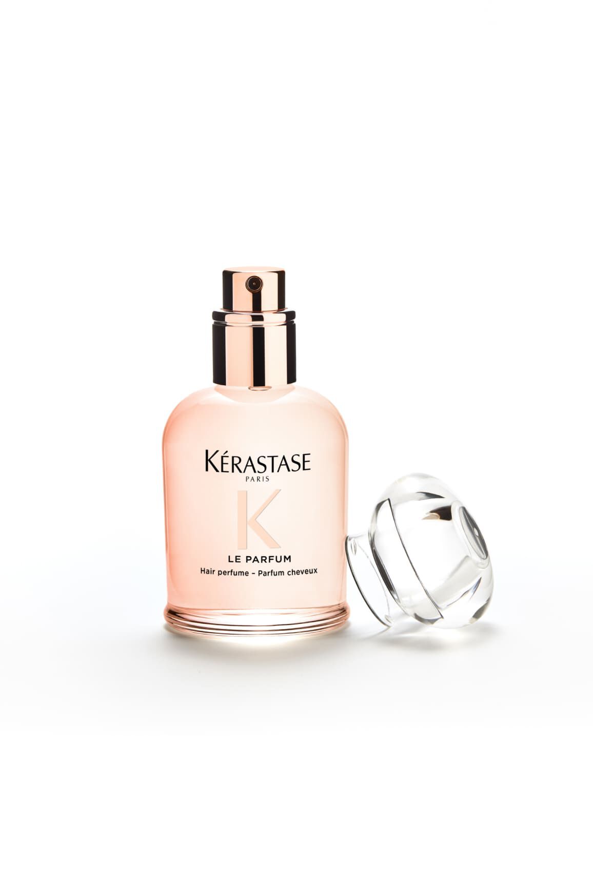 Frasco del perfume Gloss Absolu, su tapon esta colocado a su lado