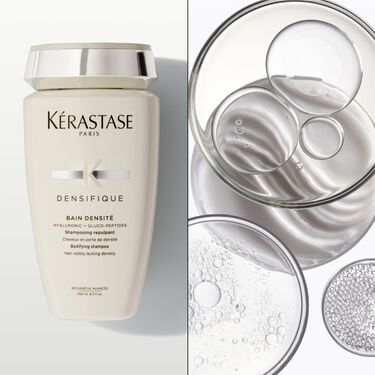 El bain densite Densifique Kerastase e appoggiato su un supporto bianco.