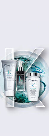 Three Kerastase hair care products displayed over a light background, surrounded by stylized water elements.