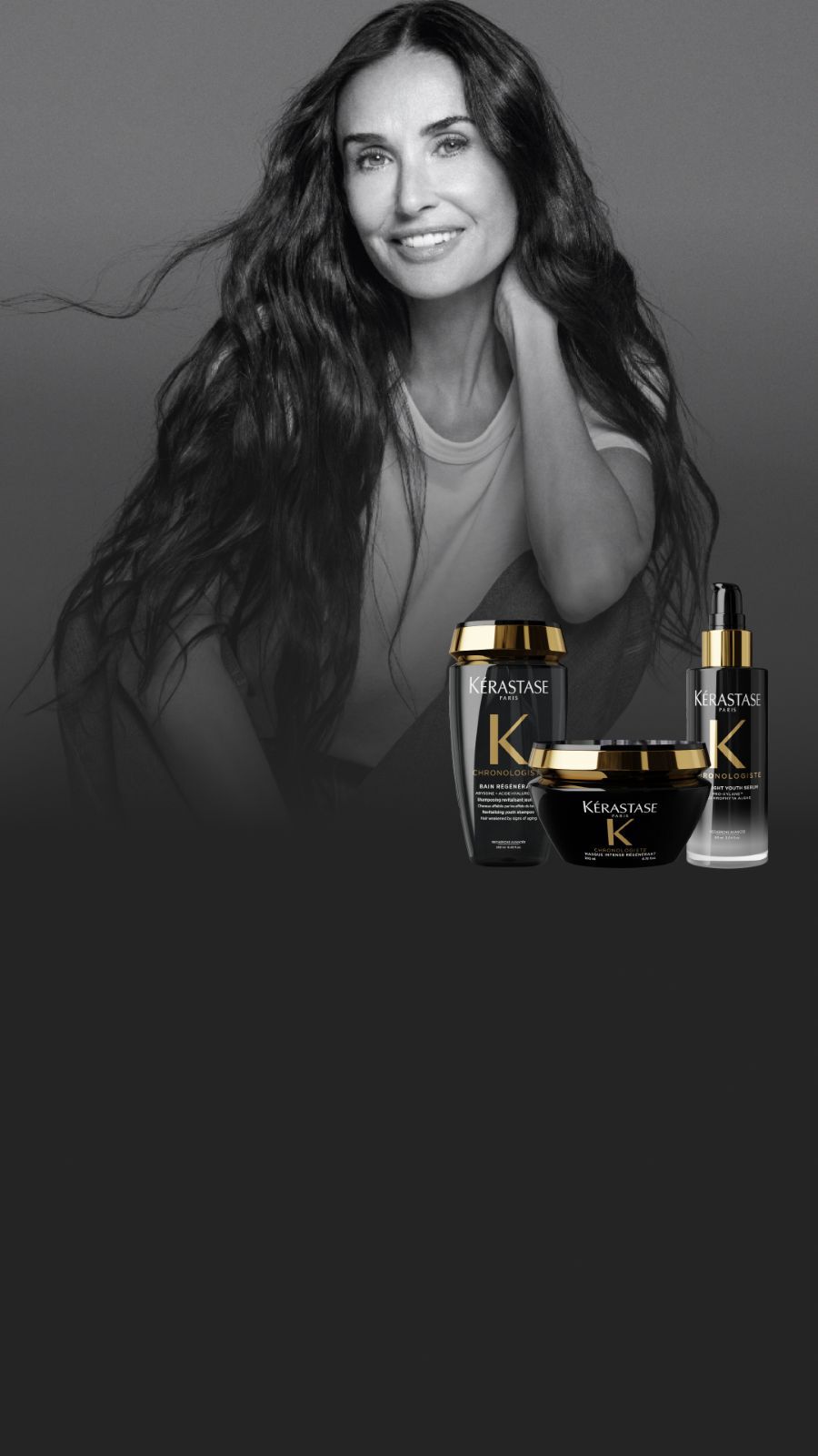 Un retrato en blanco y negro de Demi Moore con cabello largo y ondulado, junto a tres productos Kerastase Chronologiste a color.