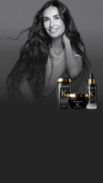 Un retrato en blanco y negro de Demi Moore con cabello largo y ondulado, junto a tres productos Kerastase Chronologiste a color.