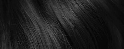 Close-up view of long, glossy black hair strands with a smooth texture.