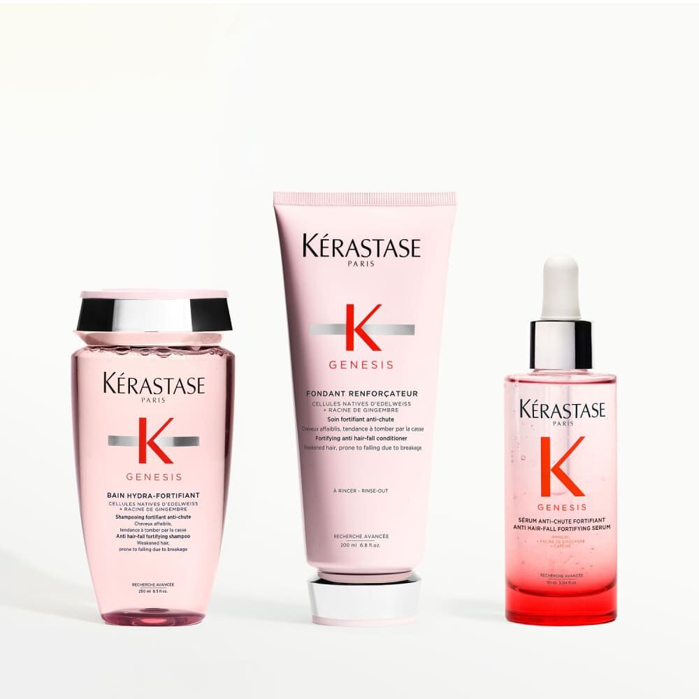 Conjunto de tres productos Kerastase Genesis: champu, acondicionador y serum, para una rutina completa.