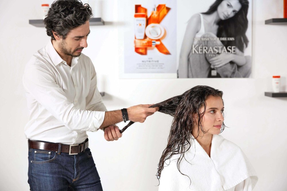 Kerastase’s Professional Hairdresser representative, Hovig –treating client’s hair with Nutritive product